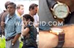 George Clooney wears an Omega DeVille watch with brown leather strap and white d