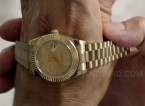 John Travolta, as Ben Aronoff in the movie Speed Kills (2018), receives a gold Rolex Oyster Perpetual Day-Date watch.