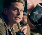 Billy Magnussen wears a black wristwatch in the 2024 heist movie Lift.