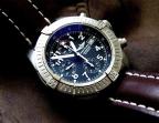 A Breitling Avenger Chrono with the same brown strap and black dial as the versi
