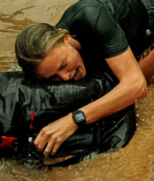 Charlize Theron wears a Nixon Staple watch in the Netflix movie Apex.