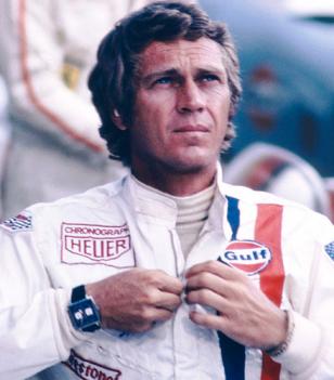 Steve McQueen wearing the Heuer Monaco and his Gulf racing suit in the movie Le 
