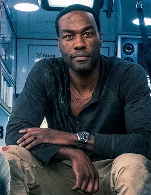 Yahya Abdul-Mateen II wears a Casio MDV106-1A Duro wristwatch in a behind the scenes photo of the movie Ambulance.