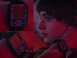 Noah Schnapp wears a Qbert Nelsonic Game Watch in Stranger Things Season 3